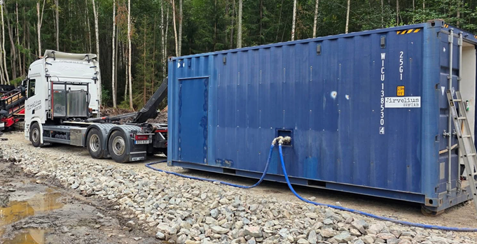 Mixercontainer på lastväxlarram
