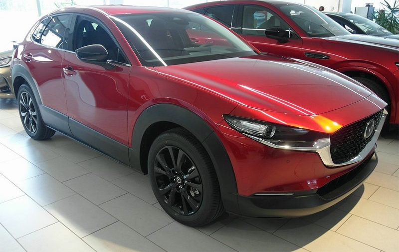 Röd metallic Mazda CX-30 Hybrid stulen i Bergsjön, Göteborg