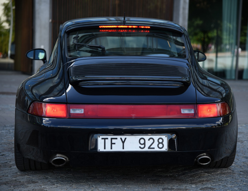 Mörkblå metallic Porsche 911/ 993 Carrera 4 stulen i Stockholm